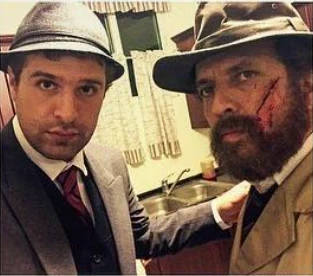 Robert Abboud with a fellow actor in make-up between takes