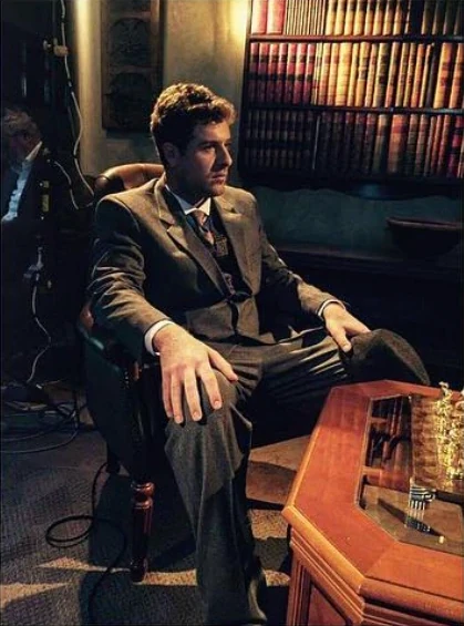 Robert Abboud on set in a period library
