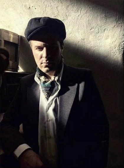 Robert Abboud in costume, lit from the side, in a Jordanian TV series