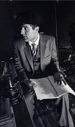 Robert Abboud reading the script on set