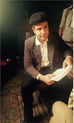 Robert Abboud with the script between takes